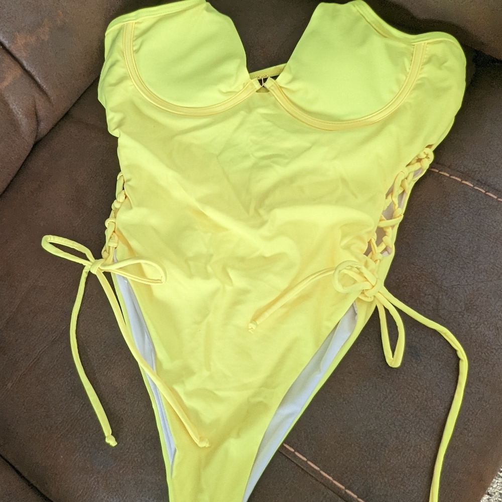 A neon yellow one piece swimsuit
